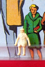 Sitting man in overcoat